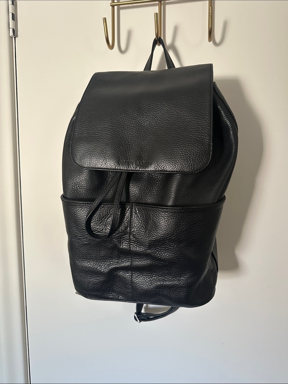 Poppy Barley Black Pebbled Leather Flap Backpack
